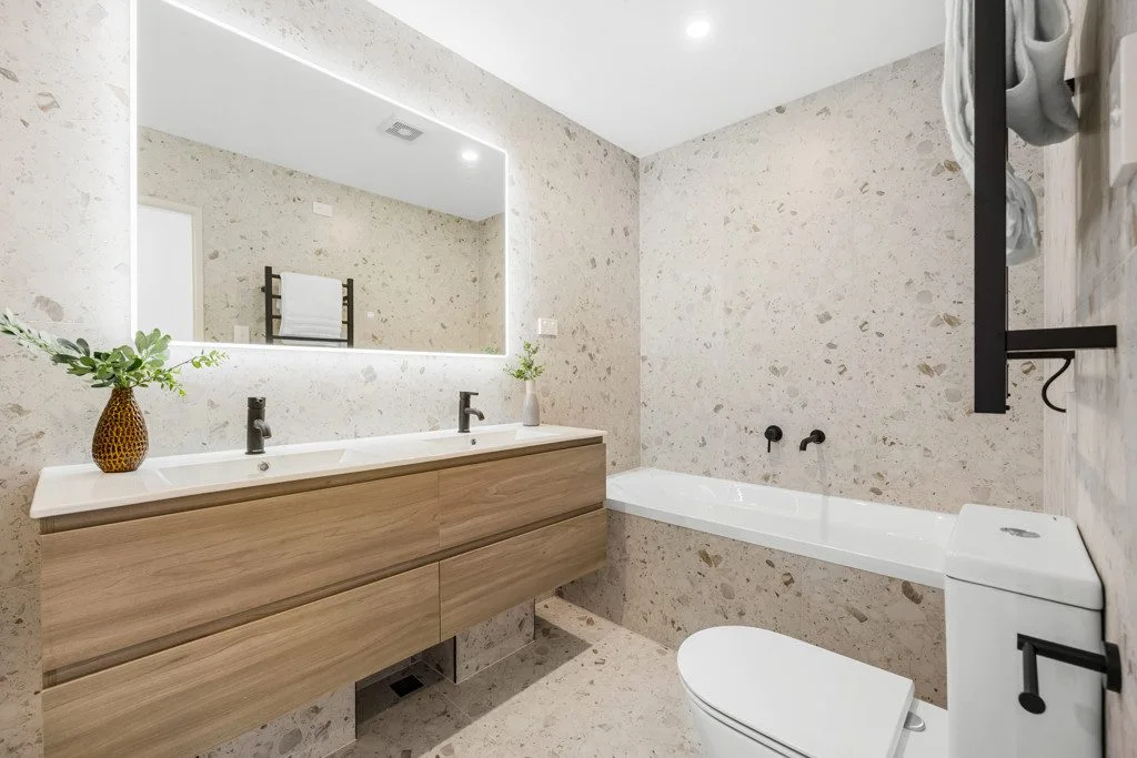 Textured light grey bathroom with timber vanity from the CT1505 catalogue